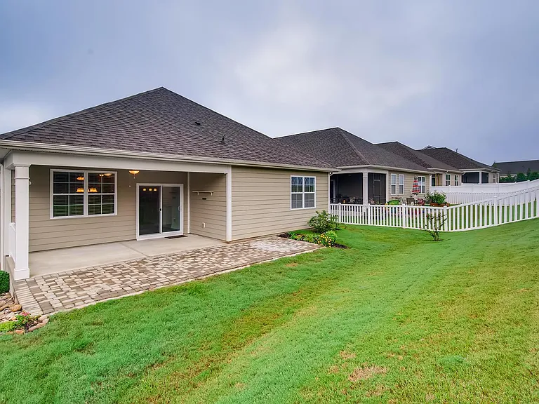 Large covered patio and extended paver patio in back.