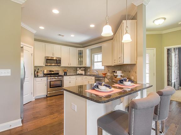 The Raleigh WE Kitchen This is a model representation, not the actual home