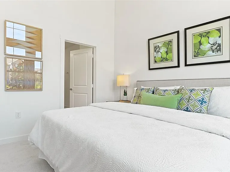 Beautiful cozy bedroom with lots of windows and sun light.