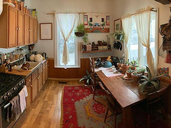 Kitchen; featuring new stainless steel refrigerator, stainless steel stove and side-by-side sink.