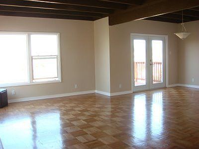 First sight to this bright living room!! Newly refinished parquet hardwood flo