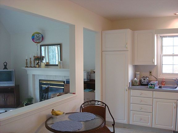 large eat-in kitchen and fireplace in family room.