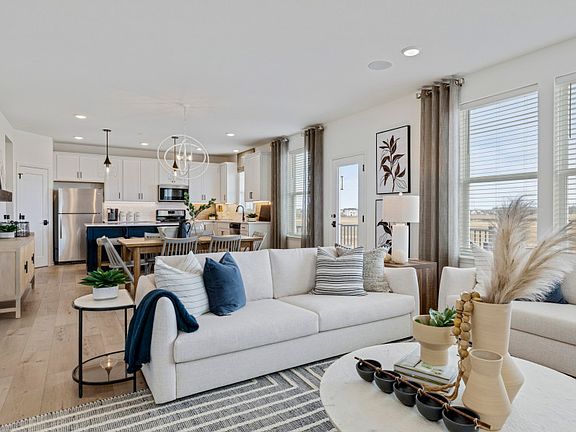 Open Concept Layout Featuring Gathering Room, Dining Room and Kitchen