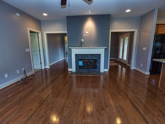 Open Living Room w/fireplace and hardwoods