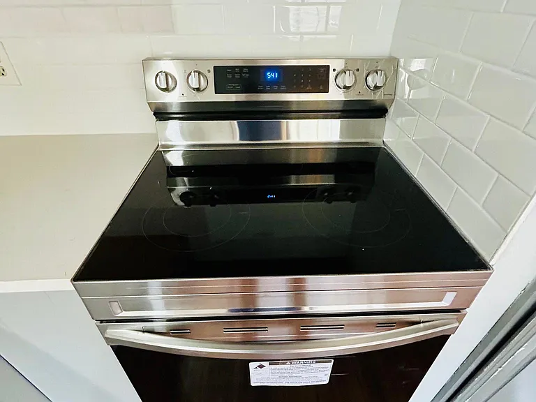 New Carrera Quartz countertops, new backsplash, new appliances