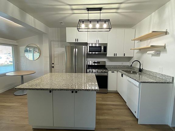 Kitchen and Dining. Island with Overhang for Bar Stools. New Stainless Steel Appliances.