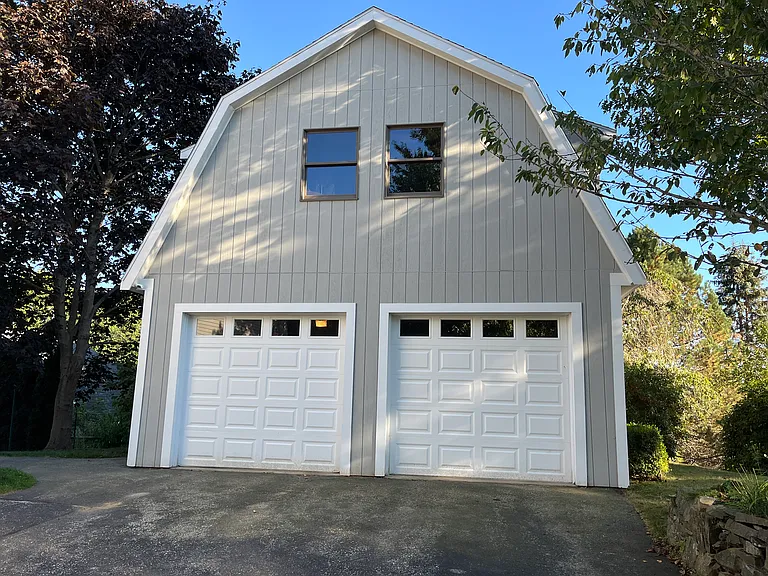 Left side of detached garage is reserved for one vehicle at no charge. One additional vehicle space in spacious driveway turnout.