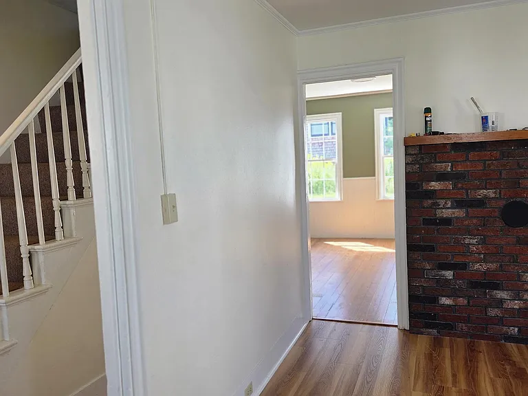 View From Living Area Into Dining Area and Hallway