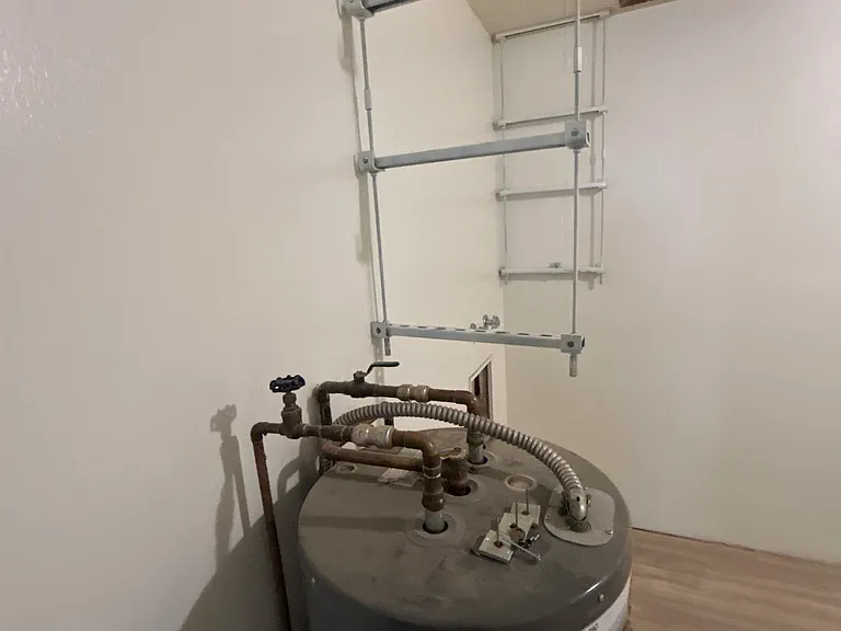 Laundry room With washer and dryer, large enough for storage or office.