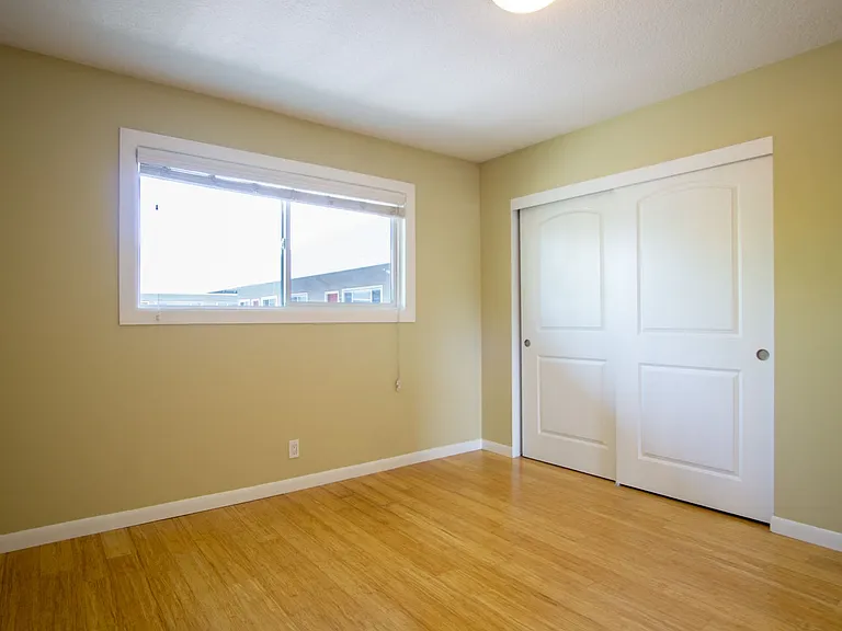 Get 1 Month FREE! Top-Floor 2-Bedroom with Bamboo Flooring + Off-Street Parking! — Photo 13
