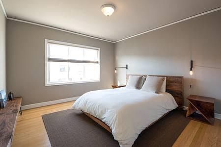 Main downstairs bedroom, view over garden.