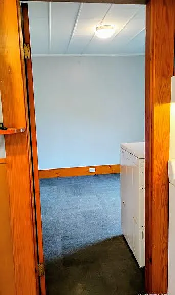 Entrance to 11x11 Bedroom, newly painted walls in sky blue with new carpet tiles. Ceiling light is dim-able.