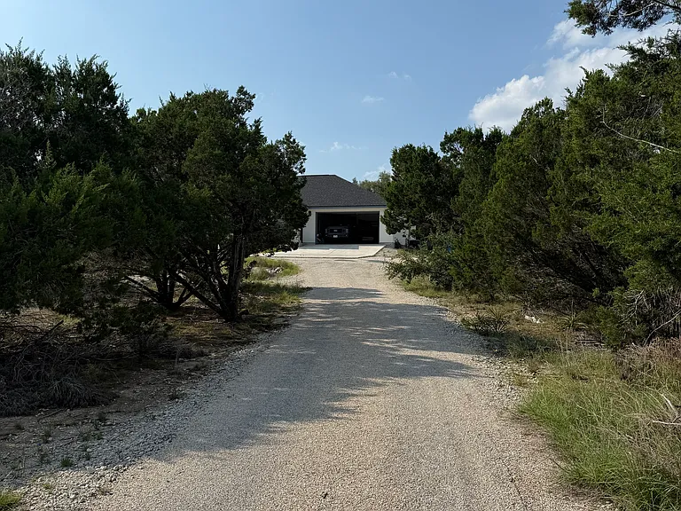 Chip seal driveway leading to home