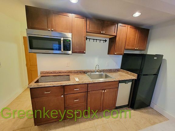 Dishwasher and small refrigerator on the right