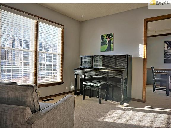 Large windows allow light in for piano playing. Piano stays with the home!