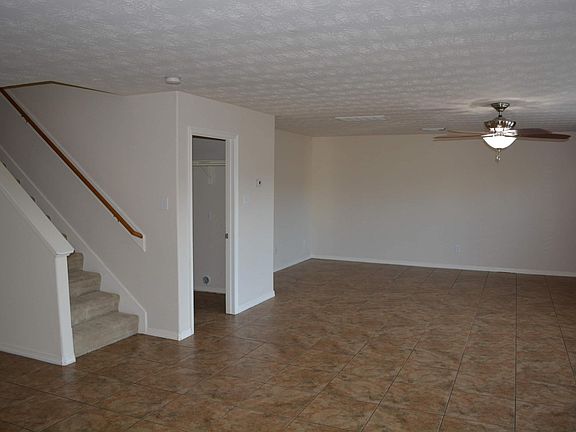 Laundry room to the right of stairs opens to the garage.