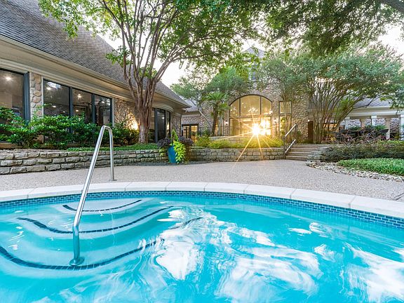 Ease into the spa inspired pool surrounded by stonework and shaded landscaping_just near the clubhouse.