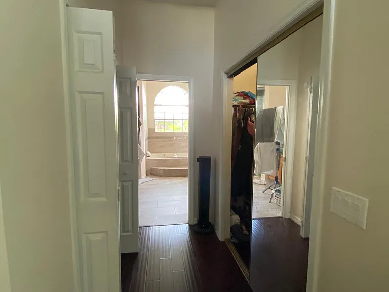 Master bedroom, huge walk-in closets on either side of passage