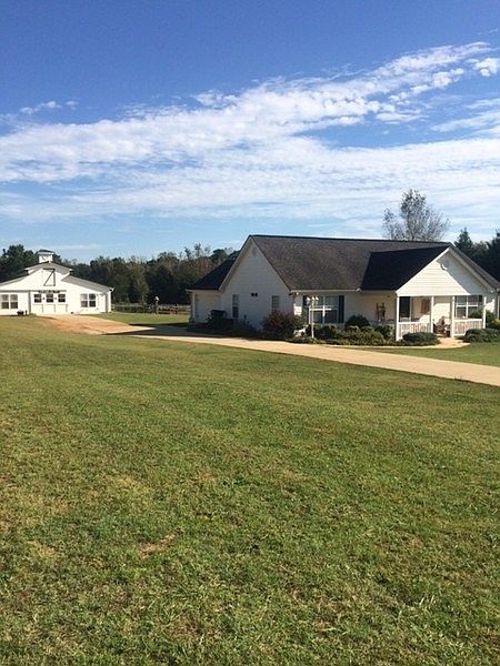 paved drive to the barn : Nice level lawn easy to care for.