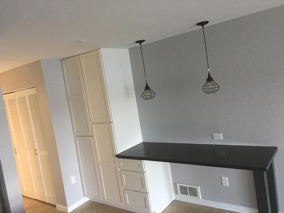 Pantry and work desk with custom desk drawers.