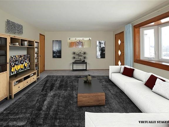 This view of the living room is from one of two closets in this room. The second closet is at the other end of the photo to the 