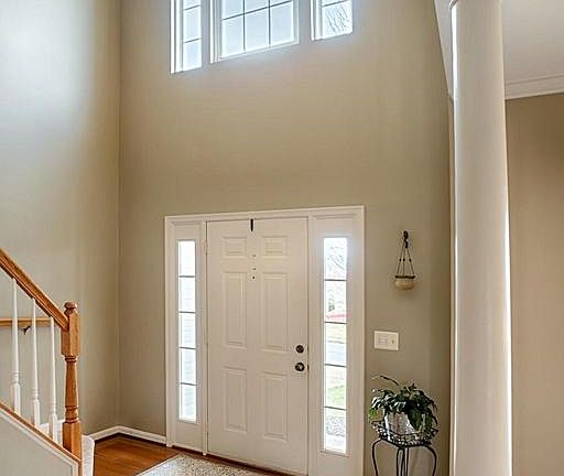 Two Story Foyer with lots of light and wood floors