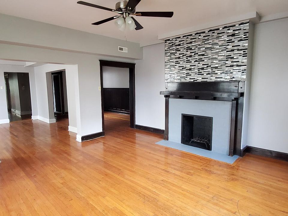 Living Room with Accented Decorative Fireplace. Leads to Entry Foyer and Dining Room