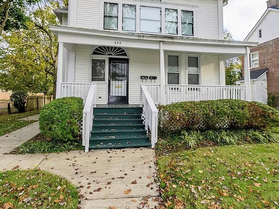 Front Door access with full wrap around porch to back gated parking area