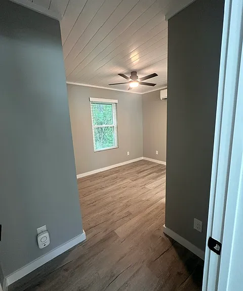 Bedroom #2 with custom, shiplap ceilings, ceiling fan, closet