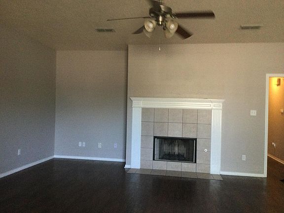 Living room with fireplace and wood floors
