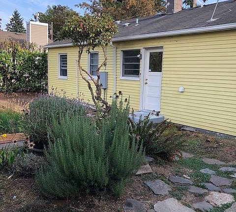 Back of home with herb garden