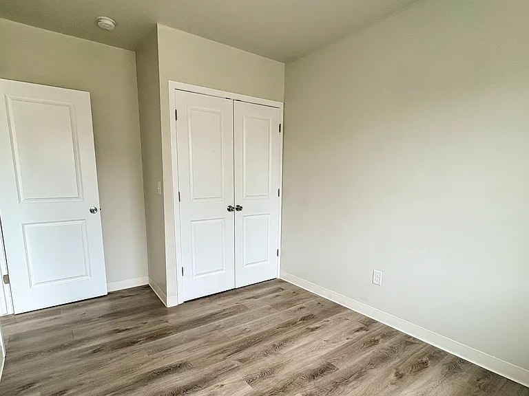 Bright, fresh bedroom space ready for your personal touch.