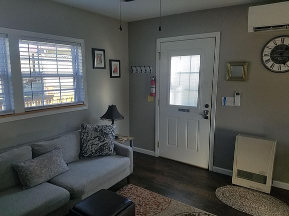 There is a ceiling fan with lights in living room as well as bedroom .