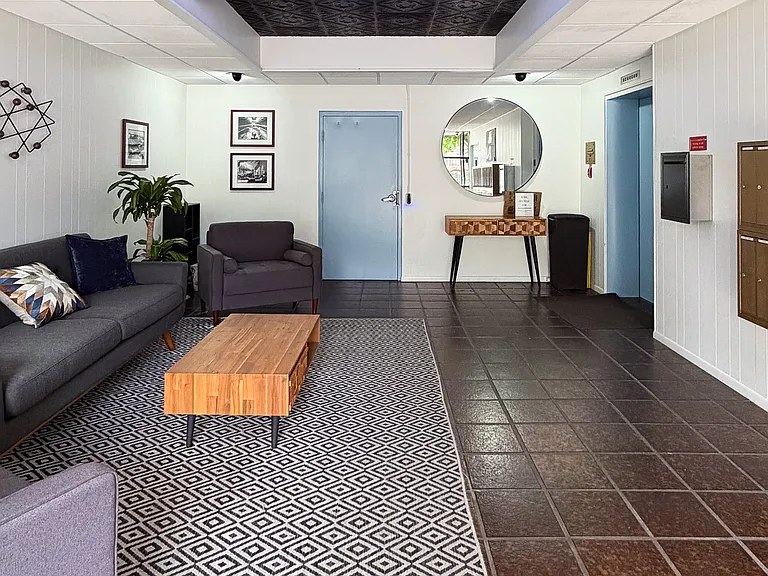 Charming mid-century lobby with secure entry and elevator access