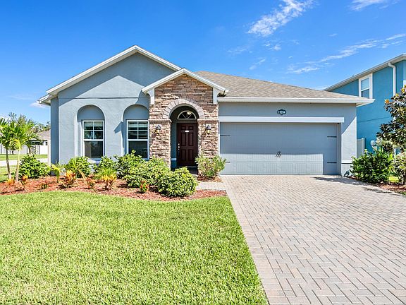 Upgraded paver driveway, stone front elevation