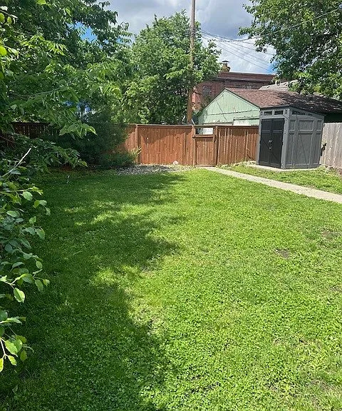 Backyard-looking toward the alley- off street packing on the other side of the fence.