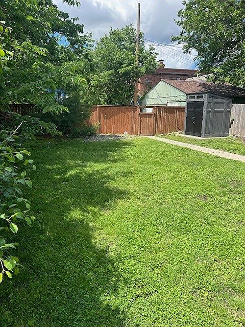 Backyard-looking toward the alley- off street packing on the other side of the fence.