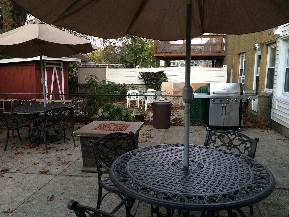 Backyard With Table, Chairs & Umbrella