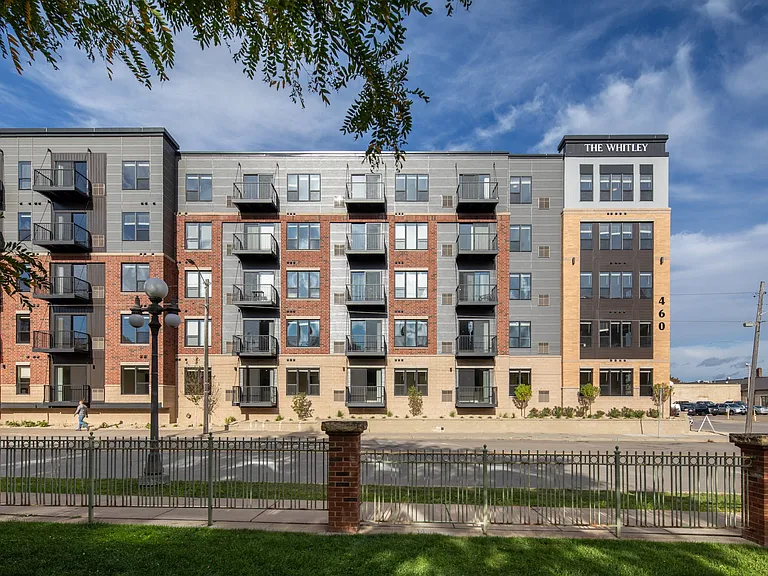 Outdoor exterior view of The Whitley apartment building.