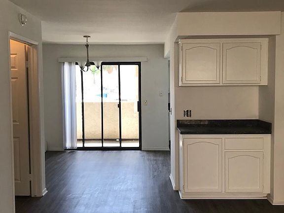 View Living area to dining to balcony