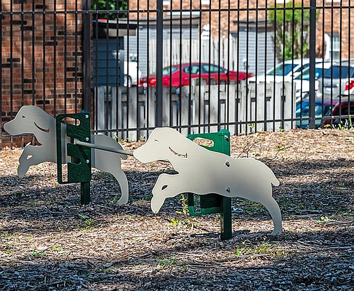 Enjoyment for pets in a secure outdoor space with imaginative dog-themed structures.