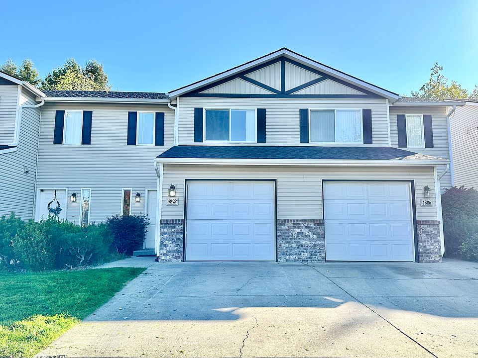front entrance of 4892 Orchid Townhome with single car garage.