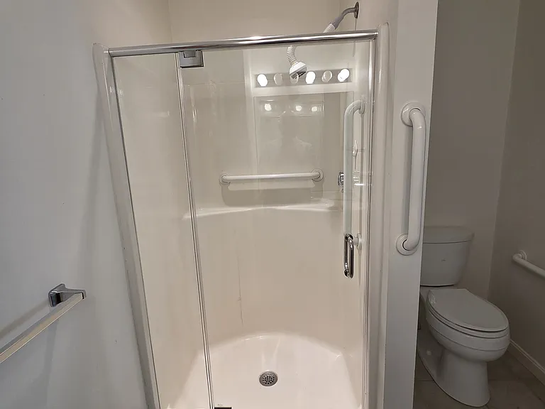 New high-end shower door installed 8/11/2026. Showerhead to be replaced.