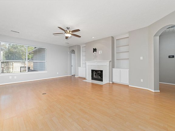 Spacious Family room with built in bookcases and gas fireplace.