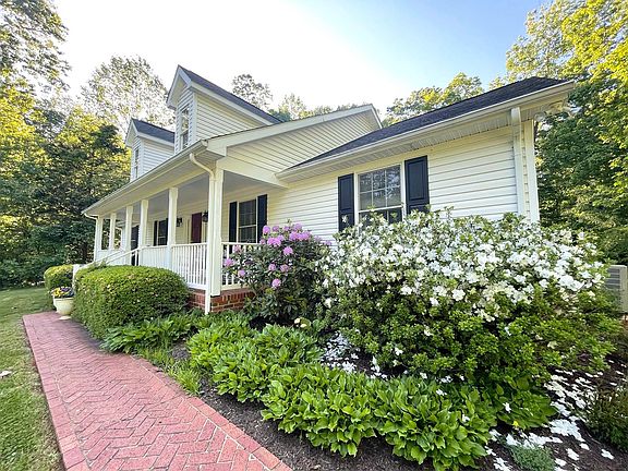 Brick herringbone walkway to front of home. Beautiful flowering bushes in the spring!