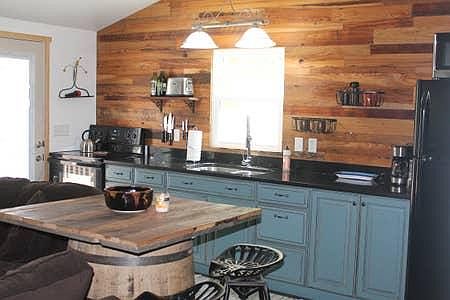 A complete kitchen with stove, oven and microwave.