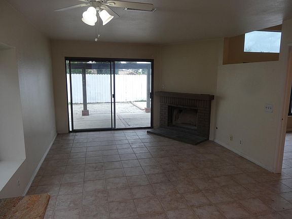 family room with fireplace, ceramic tile floor