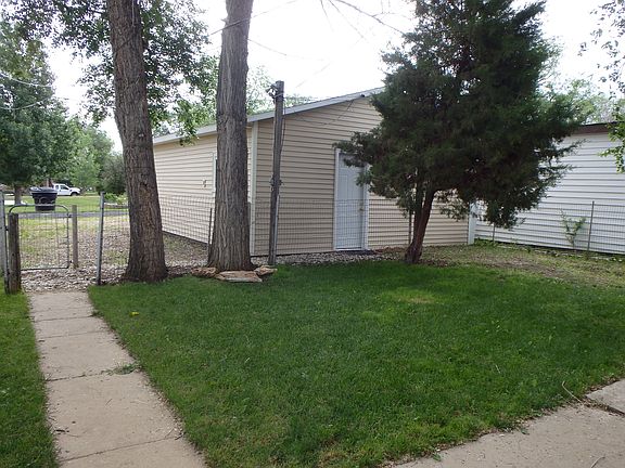 Backyard with garage view. 
