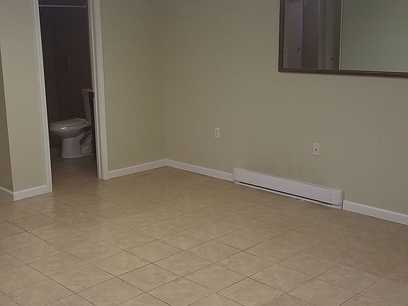 Huge space for a living area with tiled floor for easy clean