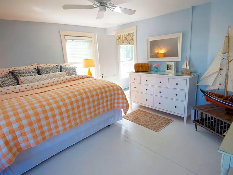 KING guest room with Ocean Views from both windows features an amazingly comfortable Beauty Rest mattress, window a/c unit, a Samsung flastrscreen, custom-designed bedding and a reading chair with ocean views. Percale sheets from Garnet Hill.